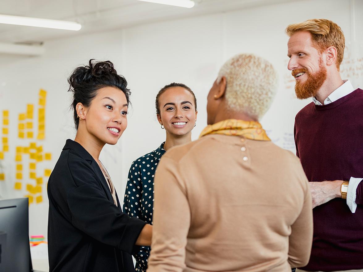 Four coworkers having a discussion